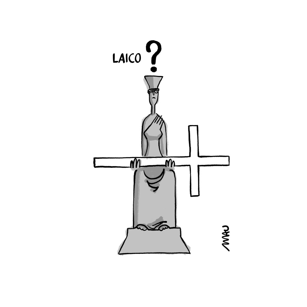 charge: sob o título, “laico?”, está a estátua da justiça, da praça dos três poderes, olhando, por baixo da venda, uma cruz que está em suas mãos, substituindo a espada.